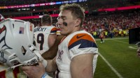 Denver Broncos quarterback Bo Nix (10) on the field after the game at GEHA Field at Arrowhead Stadium. Mandatory Credit: Denny Medley-Imagn Images