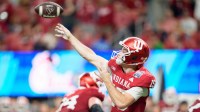 Indiana quarterback Fernando Mendoza throws a pass as the Oregon Ducks face the Indiana Hoosiers in the Peach Bowl
