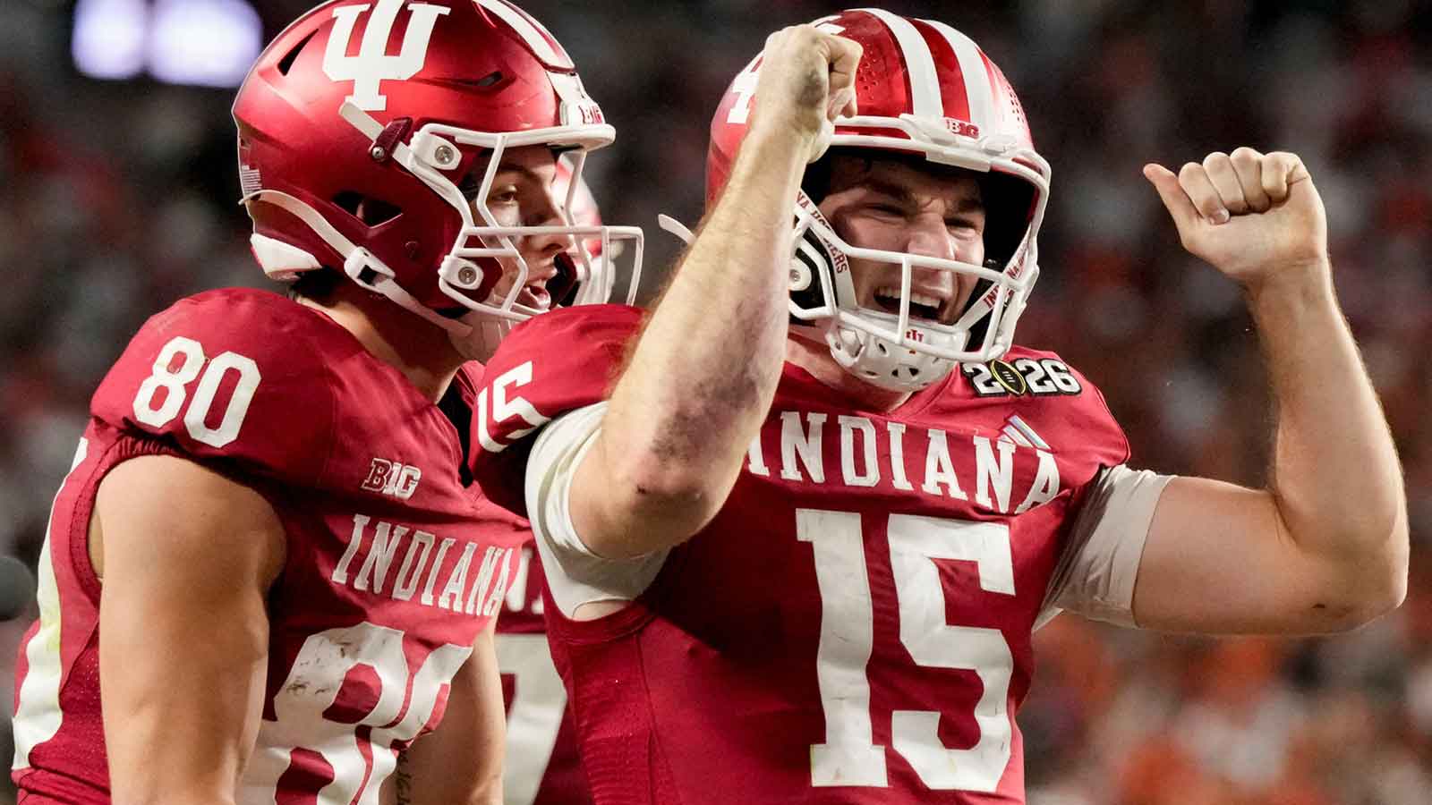 Indiana Hoosiers quarterback Fernando Mendoza (15) celebrates with his teammates after rushing for a touchdown Monday, Jan. 19, 2026, during the College Football Playoff National Championship college football game at Hard Rock Stadium in Miami Gardens.