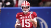 Indiana Hoosiers quarterback Fernando Mendoza (15) warms up prior to the 2025 Peach Bowl and semifinal game of the College Football Playoff against the Oregon Ducks at Mercedes-Benz Stadium.