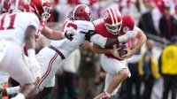 Alabama Crimson Tide linebacker Yhonzae Pierre (42) tackles Indiana Hoosiers quarterback Fernando Mendoza (15) in the first half of the 2026 Rose Bowl and quarterfinal game of the College Football Playoff at Rose Bowl Stadium.