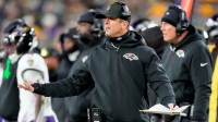 Baltimore Ravens head coach John Harbaugh reacts to a play during the first quarter against the Green Bay Packers at Lambeau Field.