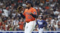 Houston Astros starting pitcher Framber Valdez (59) points towards the crowd while walking off the field after pitchign during the seventh inning against the Colorado Rockies at Daikin Park.