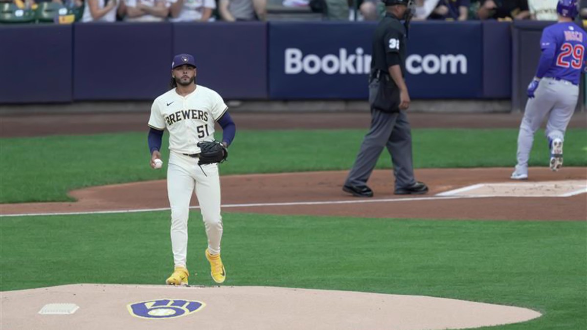 Milwaukee Brewers starting pitcher Freddy Peralta reacts after allowing a lead-off home run to Michael Busch in Game 1 of the playoff series against the Chicago Cubs