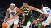 Milwaukee Bucks forward Giannis Antetokounmpo (34) fouls Orlando Magic forward Paolo Banchero (5) in the fourth quarter at Fiserv Forum.