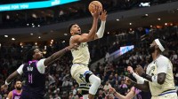 Milwaukee Bucks forward Giannis Antetokounmpo (34) takes a shot against Minnesota Timberwolves center Naz Reid (11) in the third quarter at Fiserv Forum.