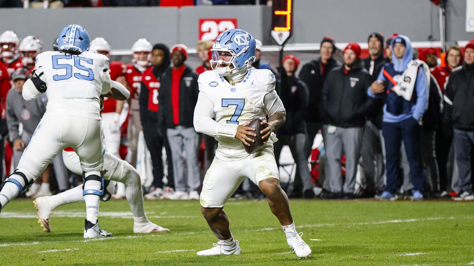 North Carolina Tar Heels quarterback Gio Lopez (7) runs with the football during the first half of the game against NC State Wolfpack at Carter-Finley Stadium. 