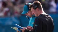 Jacksonville Jaguars head coach Liam Coen and Jacksonville Jaguars offensive coordinator Grant Udinski talk during the second quarter during an NFL football game at EverBank Stadium