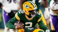 Green Bay Packers quarterback Malik Willis (2) runs the ball during the third quarter against the Baltimore Ravens at Lambeau Field.