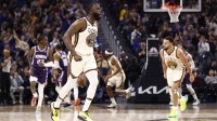 Golden State Warriors forward Draymond Green (23) celebrates after scoring a three point basket against the Sacramento Kings during the second quarter at Chase Center.