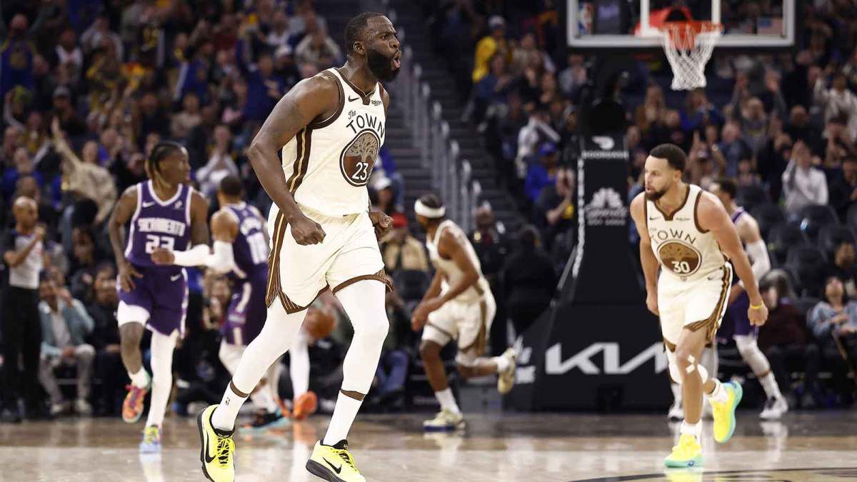 Golden State Warriors forward Draymond Green (23) celebrates after scoring a three point basket against the Sacramento Kings during the second quarter at Chase Center.