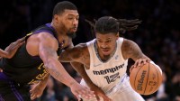 Los Angeles Lakers guard Marcus Smart (36) defends Memphis Grizzlies guard Ja Morant (12) as he drives to the basket in the second half at Crypto.com Arena.