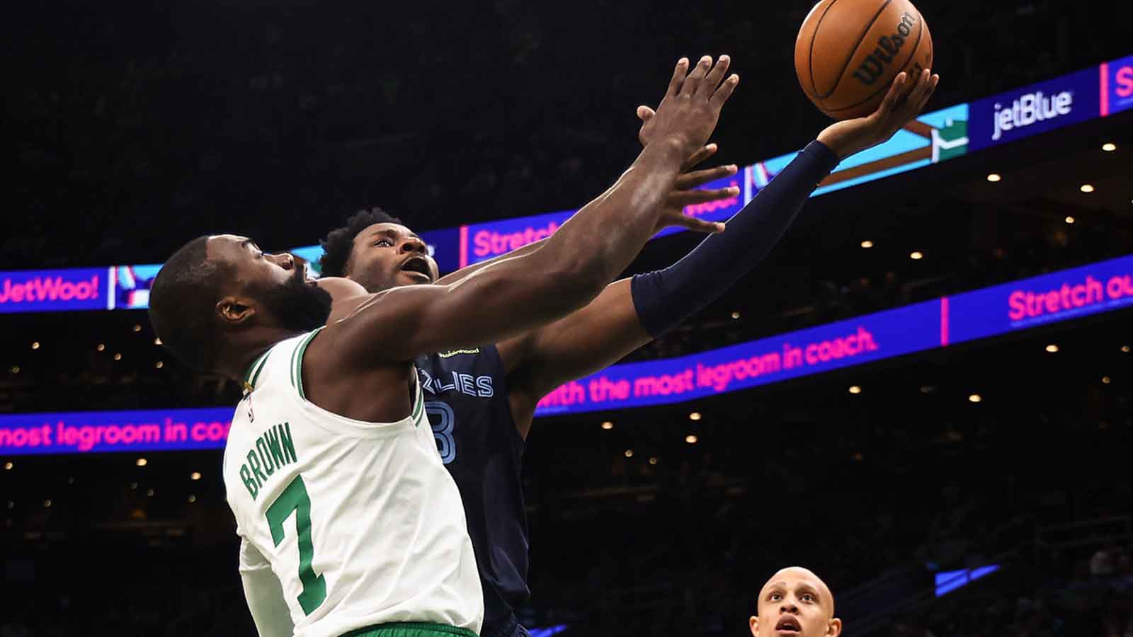 Grizzlies forward Jaren Jackson Jr. (8) goes to the basket against Boston Celtics guard Jaylen Brown (7) during the second quarter at TD Garden