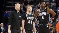 Memphis Grizzlies head coach Tuomas Iisalo (left), guard Cam Spencer (24) and forward/center Jaren Jackson Jr. (8) looks on during the fourth quarter against the Oklahoma City Thunder at FedExForum.