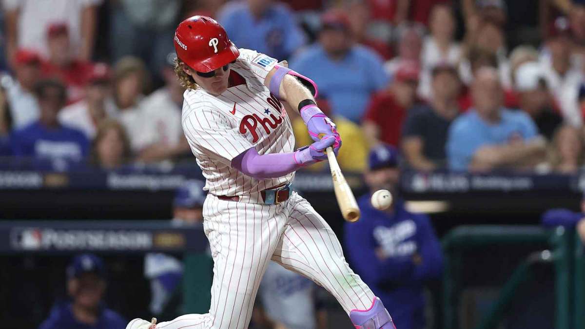 Philadelphia Phillies left fielder Harrison Bader (2) hits an RBI sacrifice fly against the Los Angeles Dodgers in the second inning during game one of the NLDS round for the 2025 MLB playoffs at Citizens Bank Park
