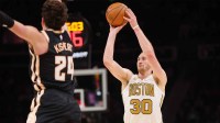 Boston Celtics forward Sam Hauser (30) shoots against the Atlanta Hawks in the fourth quarter at State Farm Arena.