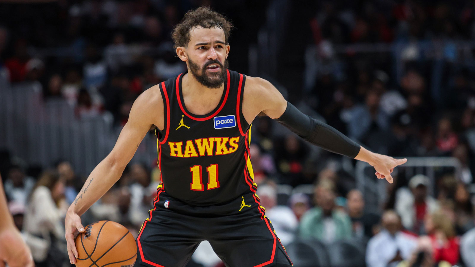 Atlanta Hawks guard Trae Young (11) points to teammates during the game against the Miami Heat during the third quarter at State Farm Arena. 