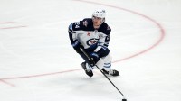Winnipeg Jets defenseman Haydn Fleury (24) skates with the puck during the third period against the Anaheim Ducks at Honda Center.