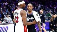 Heat's Bam Adebayo and Kings' DeMar DeRozan hug