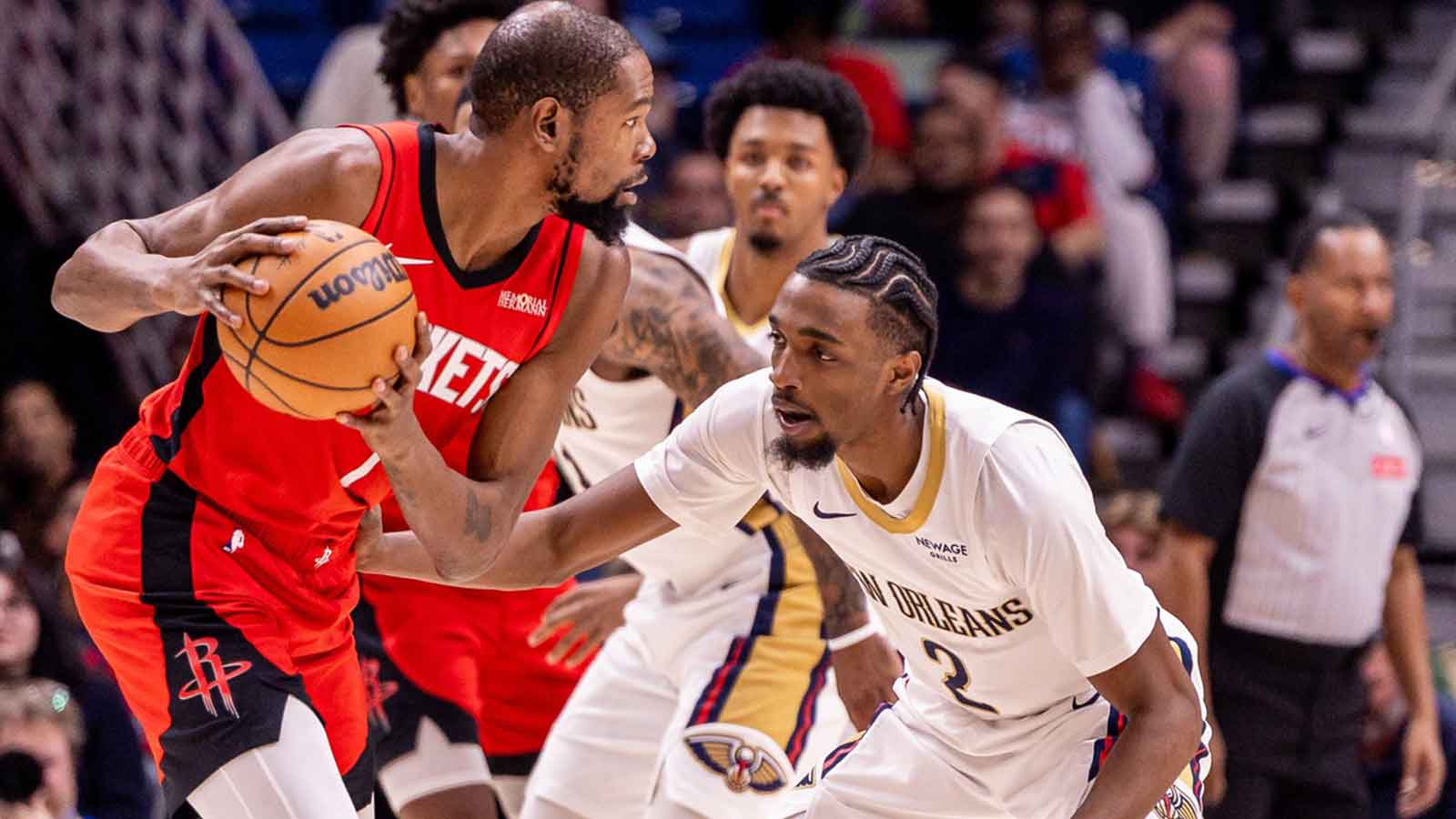 Houston Rockets forward Kevin Durant (7) dribbles against New Orleans Pelicans forward Herbert Jones (2) during the first half at Smoothie King Center.