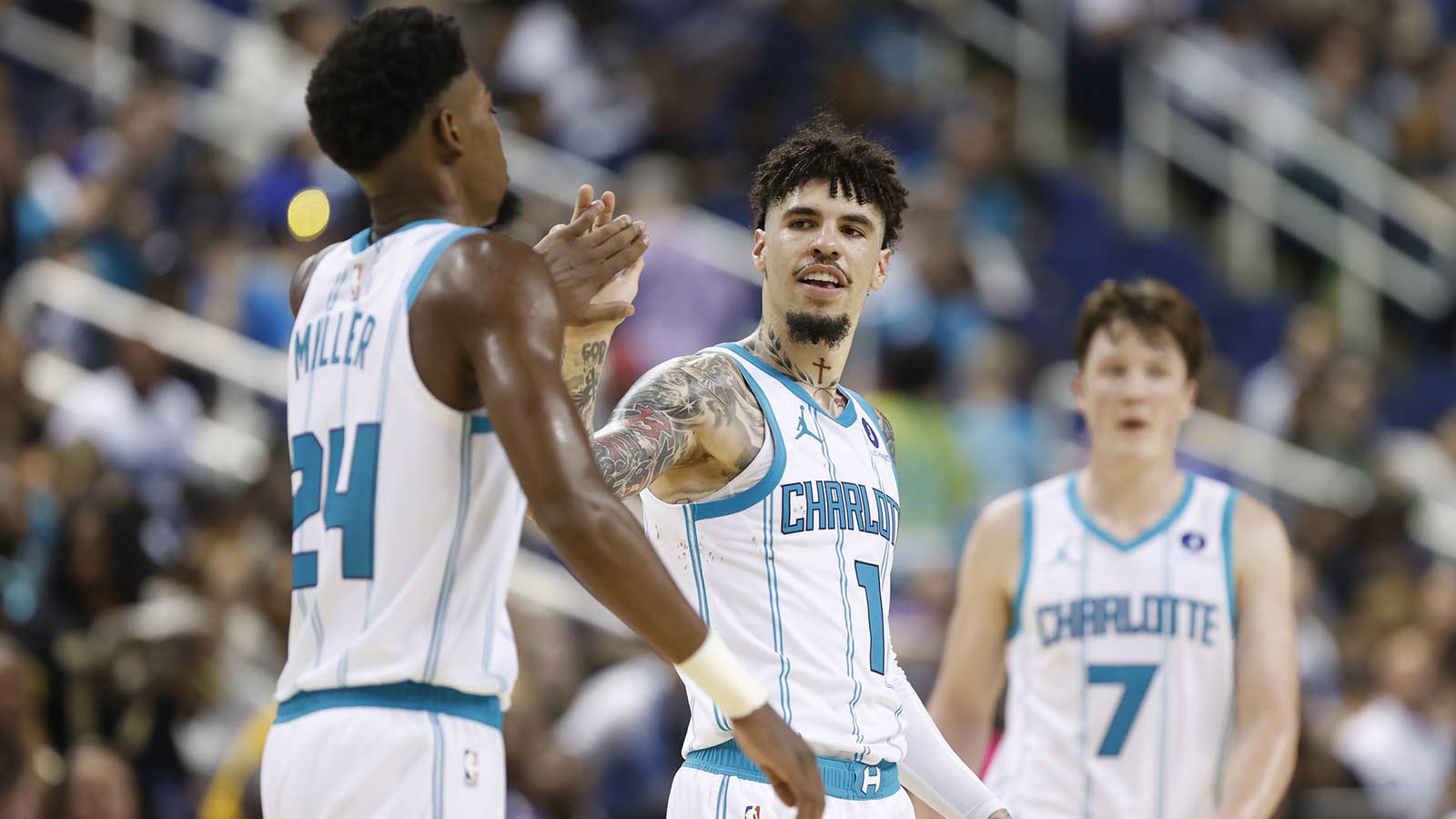 Hornets guard LaMelo Ball (1) celebrates with forward Brandon Miller (24) during the second half against the Memphis Grizzlies at First Horizon Coliseum