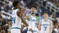 Hornets guard LaMelo Ball (1) celebrates with forward Brandon Miller (24) during the second half against the Memphis Grizzlies at First Horizon Coliseum