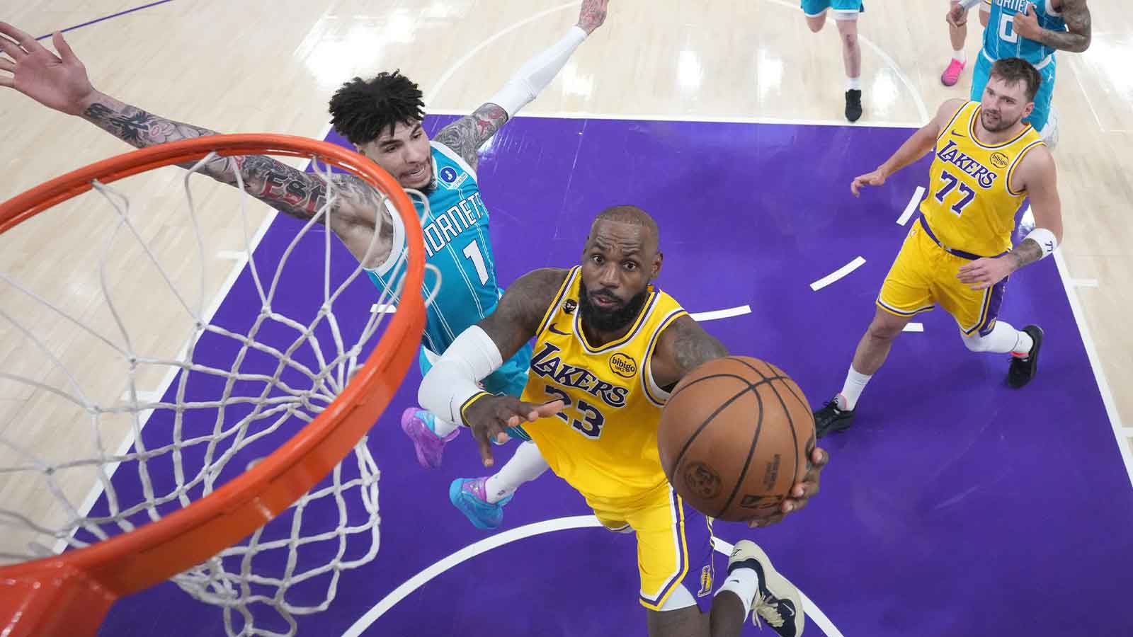 Lakers forward LeBron James (23) shoots the ball against Charlotte Hornets guard LaMelo Ball (1) in the second half at Crypto.com Arena