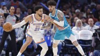 Hornets guard LaMelo Ball defends