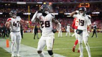 Houston Texans running back Joe Mixon (28) celebrates with fullback Andrew Beck (47) and wide receiver Xavier Hutchinson (19) after scoring a touchdown against the Kansas City Chiefs during the third quarter of a 2025 AFC divisional round game at GEHA Field at Arrowhead Stadium.