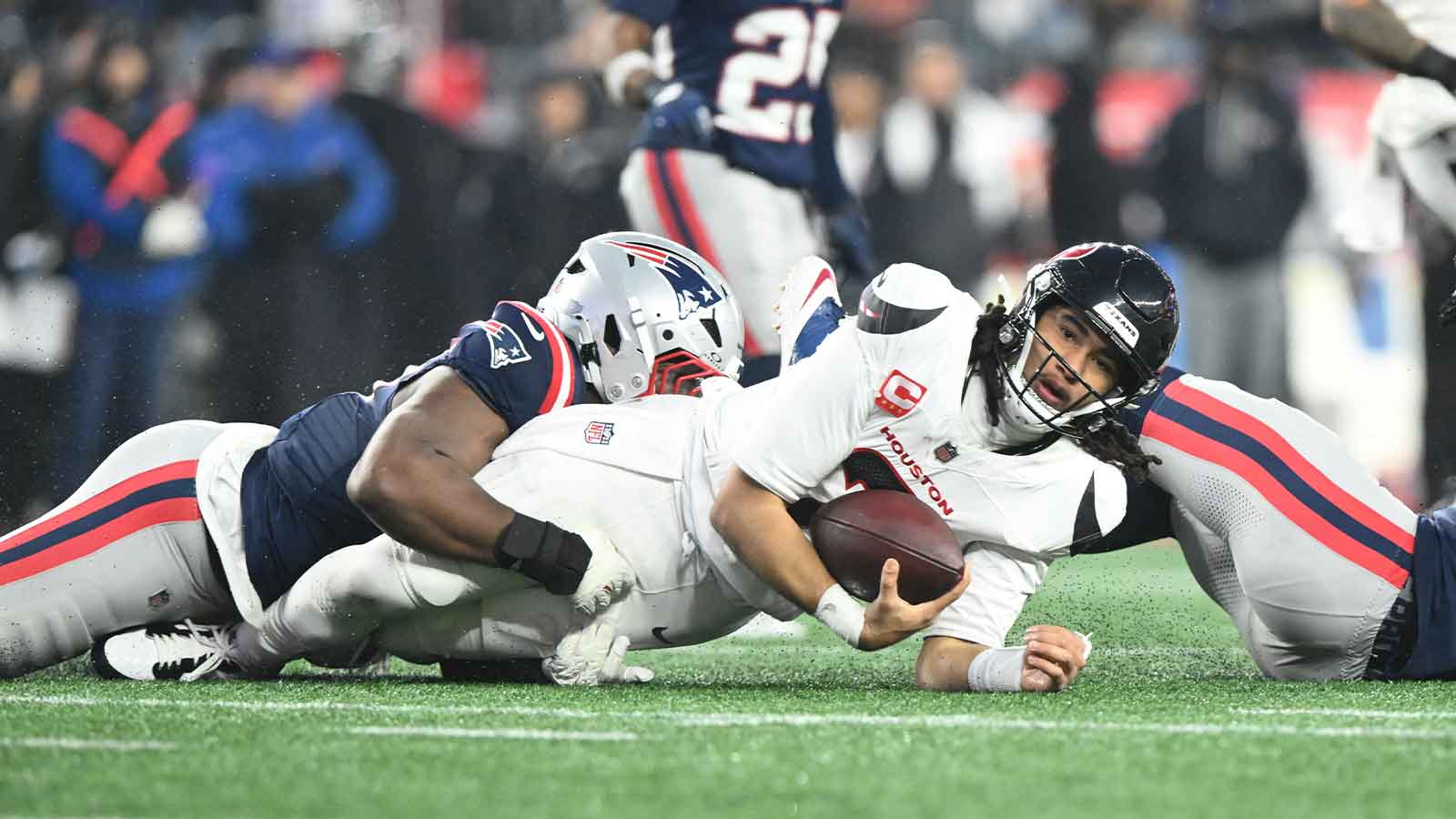 Houston Texans quarterback C.J. Stroud (7) is sacked in the second quarter against the New England Patriots in an AFC Divisional Round game at Gillette Stadium. 