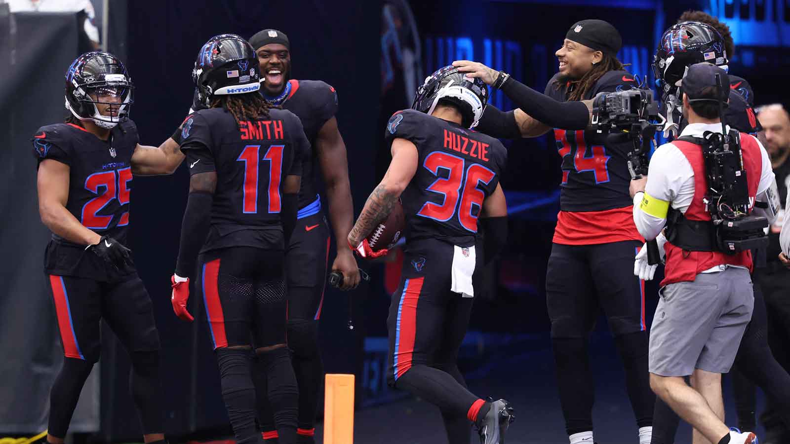 Houston Texans cornerback Alijah Huzzie (36) reacts with teammates after an interception against the Indianapolis Colts during the second half at NRG Stadium.