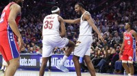Cleveland Cavaliers forward Nae'qwan Tomlin (35) reacts with center Evan Mobley (4) after dunking the ball against the Philadelphia 76ers during the fourth quarter quarter at Xfinity Mobile Arena.