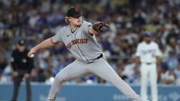 San Francisco Giants pitcher Logan Webb (62) pitches during the first inning against the Los Angeles Dodgers at Dodger Stadium.