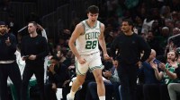 Boston Celtics guard Hugo Gonzalez (28) celebrates after making a three point basket against the Detroit Pistons during the first quarter at TD Garden.