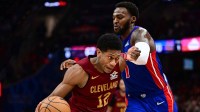 Cleveland Cavaliers forward De'andre Hunter (12) drives to the basket against Detroit Pistons forward Paul Reed (7) during the second half at Rocket Arena.