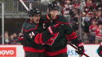 Carolina Hurricanes center Seth Jarvis (24) celebrates his goal with center Jordan Staal (11) against the Buffalo Sabres during the third period at Lenovo Center.