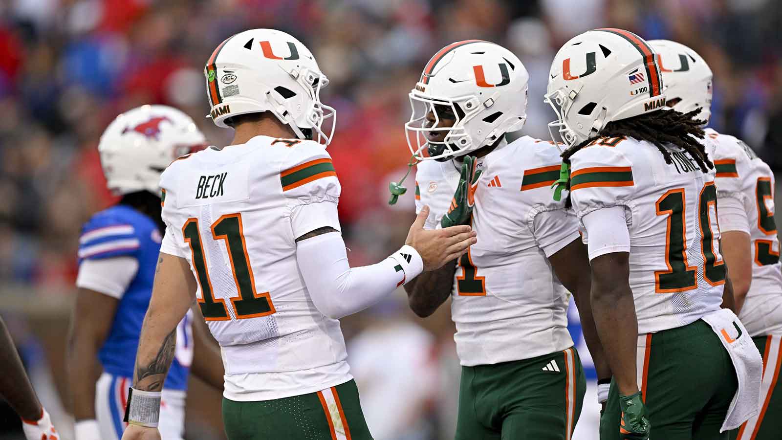 Miami Hurricanes wide receiver Joshisa Trader (1) and quarterback Carson Beck (11) celebrates a touchdown against the SMU Mustangs during the first quarter at Gerald J. Ford Stadium.