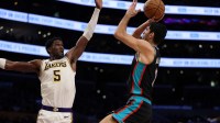Memphis Grizzlies forward Santi Aldama (7) shoots the ball against Los Angeles Lakers center Deandre Ayton (5) during the third quarter at Crypto.com Arena.