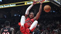 Toronto Raptors forward Collin Murray-Boyles (12) dunks for a basket against the Philadelphia 76ers in the second half at Scotiabank Arena.
