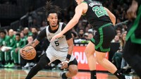 San Antonio Spurs guard Stephon Castle (5) drive es to the basket against Boston Celtics guard Hugo Gonzalez (28) during the first half at the TD Garden.