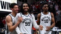 Vanderbilt Commodores guard Miles Keeffe (25), forward Devin McGlockton (99), and forward Ak Okereke (10) celebrate the win against the Alabama Crimson Tide during the second half at Memorial Gymnasium.