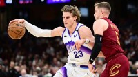 Utah Jazz forward Lauri Markkanen (23) drives to the basket against Cleveland Cavaliers guard Sam Merrill (5) during the second half at Rocket Arena.