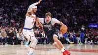 Dallas Mavericks forward Cooper Flagg (32) drives against New York Knicks guard Josh Hart (3) during the fourth quarter at Madison Square Garden.