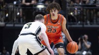Illinois Fighting Illini guard Keaton Wagler (23) looks to dribble around Purdue Boilermakers guard Braden Smith (3) during the first half at Mackey Arena.