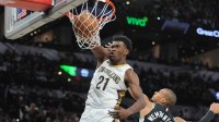 New Orleans Pelicans center Yves Missi (21) dunks in front of San Antonio Spurs forward Victor Wembanyama (1) in the second half at Frost Bank Center.