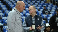 Los Angeles Clippers owner Steve Ballmer, left, talks with Lawrence Frank, President of Basketball Operations, prior to game one of the first round for the 2024 NBA playoffs against the Dallas Mavericks at Crypto.com Arena.
