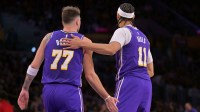 Los Angeles Lakers guard Luka Doncic (77) and center Jaxson Hayes (11) on the court after a basket during the first half against the San Antonio Spurs at Crypto.com Arena.