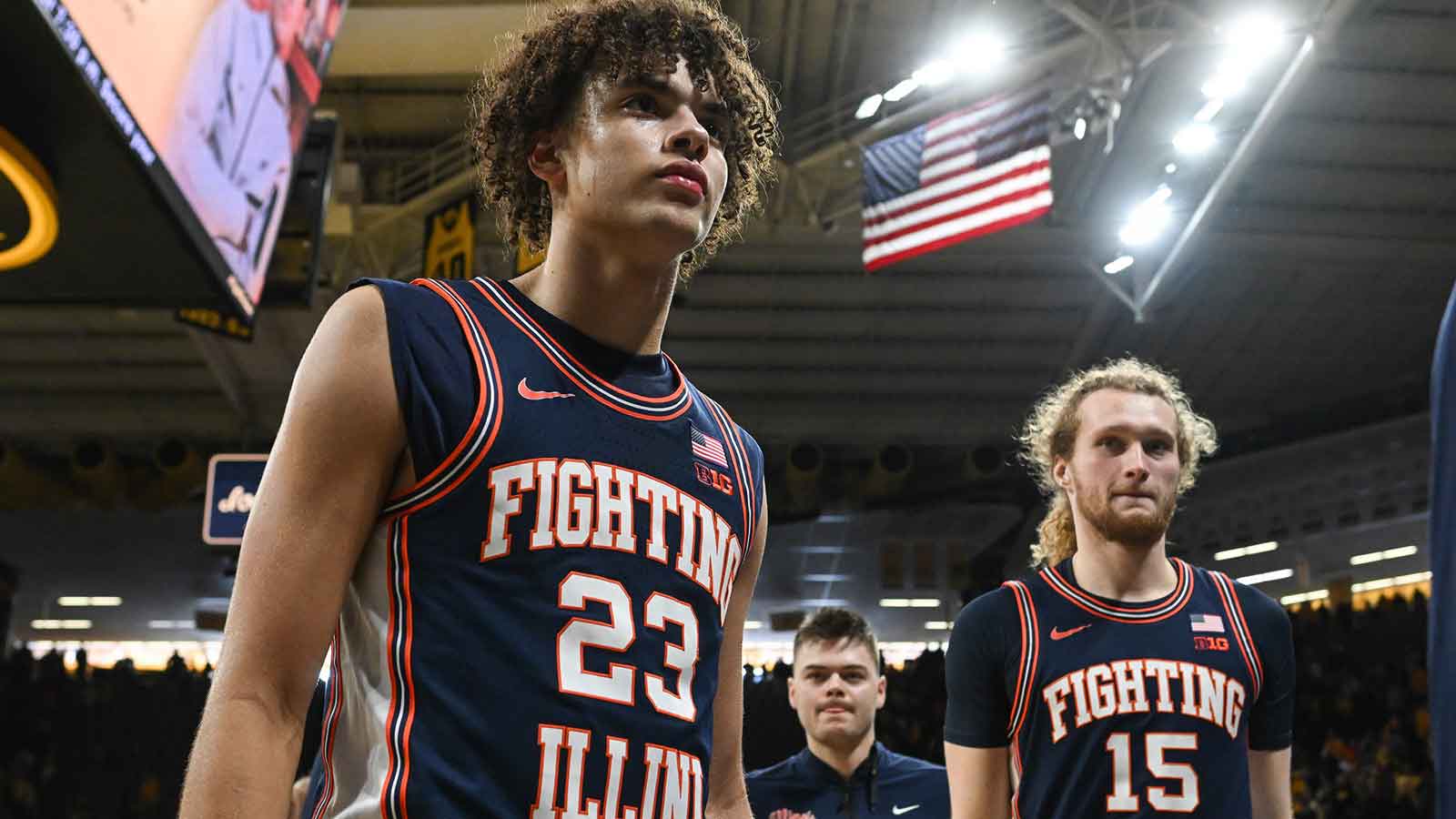 Illinois Fighting Illini guard Keaton Wagler (23) and forward Jake Davis (15) walk off the court after the game against the Iowa Hawkeyes at Carver-Hawkeye Arena. 