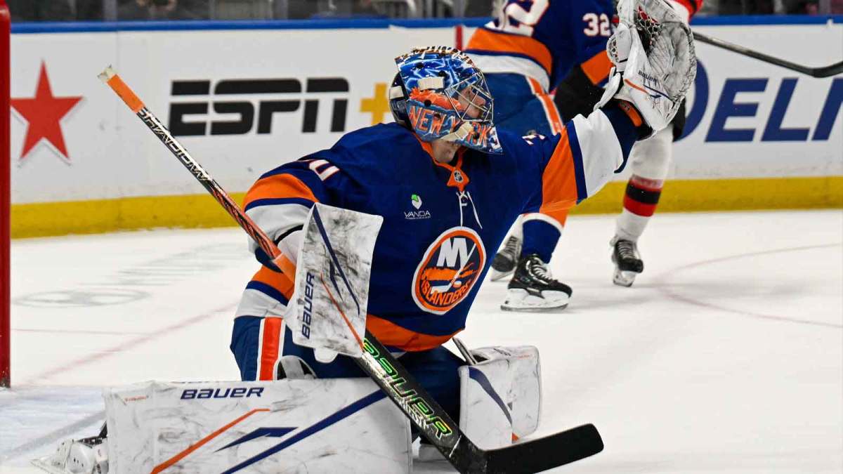 New York Islanders goaltender Ilya Sorokin (30) makes a glove save against the New Jersey Devils during the first period at UBS Arena.