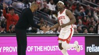 Houston Rockets forward Jae'Sean Tate (8) shakes hands with head coach Ime Udoka after scoring during the third quarter against the Phoenix Suns at Toyota Center.